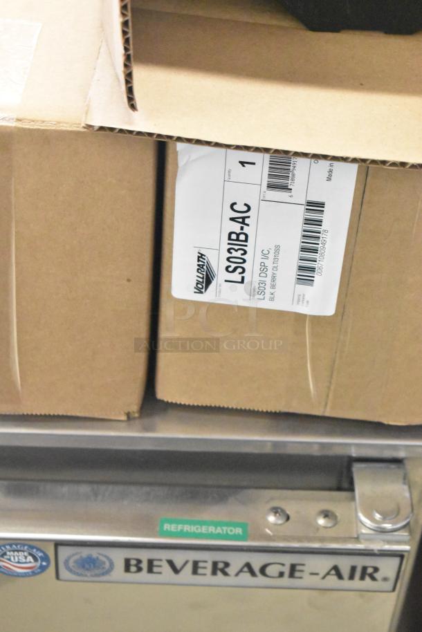 New Vollrath LS03IB-AC LidSaver™ 3 in-counter dispensers for 3 1/4" - 3 3/4" lids; shipping boxes displayed.