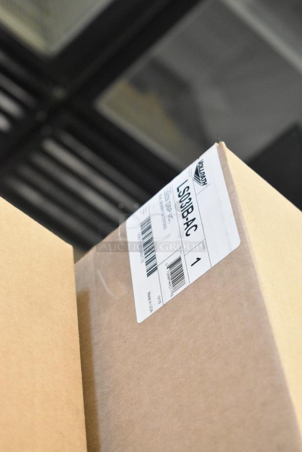Alt text: Cardboard box with Vollrath LS03IB-AC label, containing LidSaver™ 3 In-Counter Lid Dispenser, new condition.