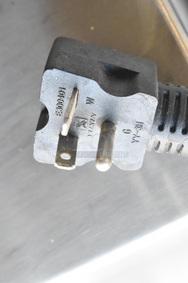 A close-up of a power plug for the Eurodib M30A 30 Quart Planetary Dough Mixer, showing electrical markings.
