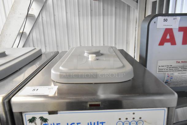 Taylor 441-33 stainless steel soft serve ice cream machine, on commercial casters, 208-230V, 3 Phase, shown with lid.