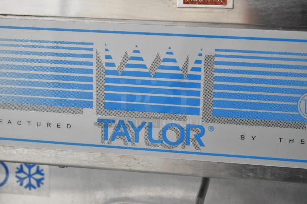 Taylor 441-33 stainless steel soft serve ice cream machine, water-cooled, single flavor, on commercial casters.