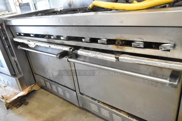 Garland SunFire stainless steel gas-powered 10-burner range with two ovens, over shelf, and backsplash. Used condition.