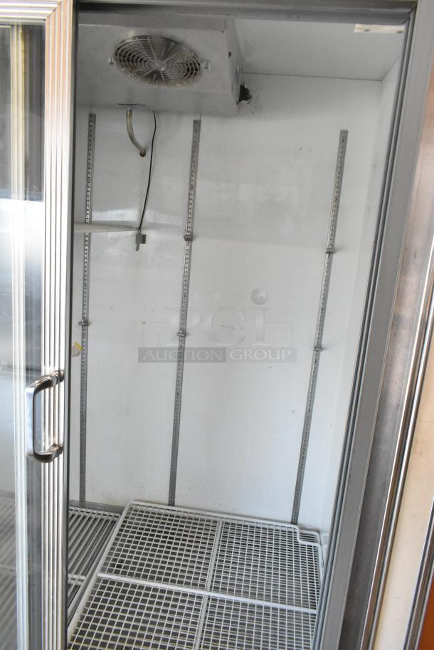 R-54SC Metal Commercial 2 Door Reach In Cooler Merchandiser showing interior shelving, fan, and glass doors. Model R-54SC. Input: 115 volts, 1 phase.