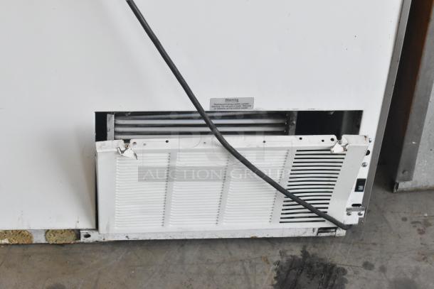 Metal commercial ice cream dipping cabinet with bucket collars, visible vent and warning label. Fair condition.