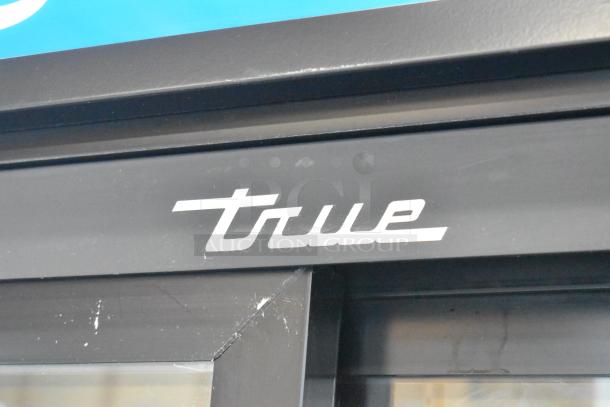 2018 True GDM-45-HC-LD cooler, black metal frame with "True" logo, 115V, poly-coated racks, 2 glass doors.