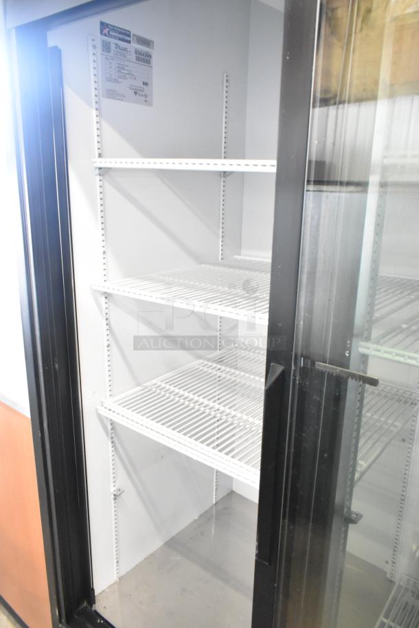 2018 True GDM-45-HC-LD commercial cooler with poly-coated racks, 2 glass doors, in good condition, 115 volts, 1 phase.