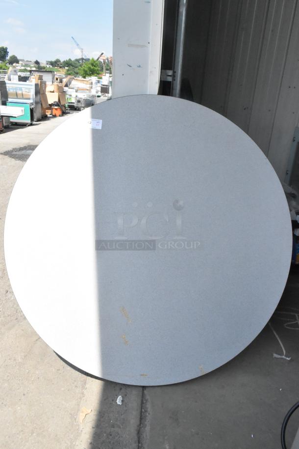 Gray round tabletop, slight wear visible, marked tag C2 for auction. Set of 5, durable material, versatile design.
