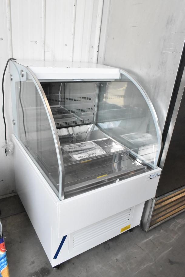 Brand new Avantco 193HAC28W 28" white horizontal air curtain merchandiser with 1 shelf, LED lighting, minor imperfections.
