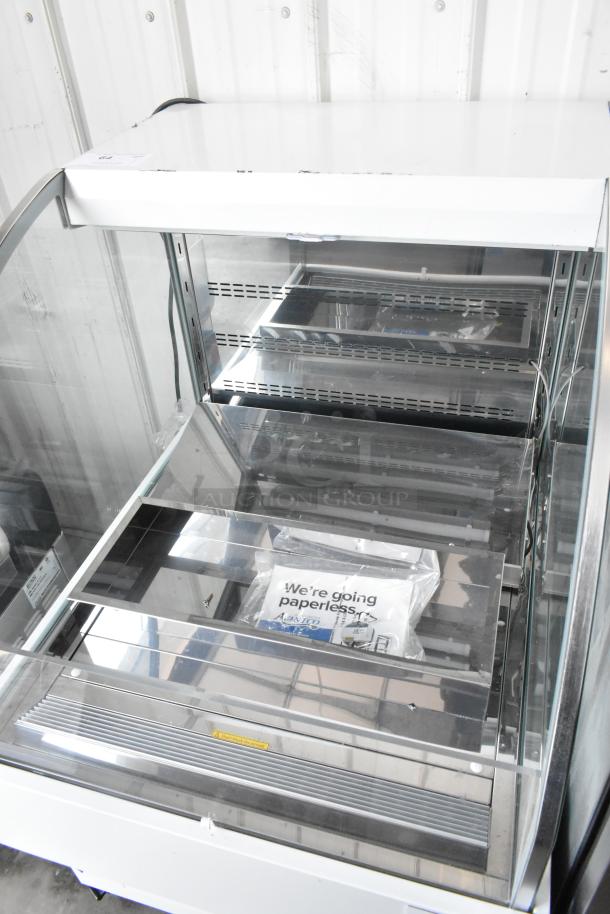 Brand new Avantco 193HAC28W white horizontal air curtain merchandiser, 28", 1 shelf, LED lighting, 115V, scratch and dent.