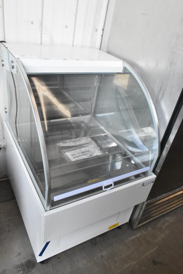 Brand new Avantco 193HAC28W white 28" horizontal air curtain merchandiser, 1 shelf, LED lighting, minor scratches.