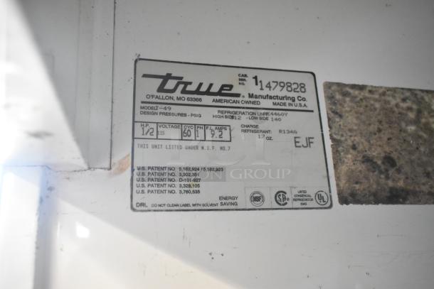 True T-49 cooler label showing model, 115 volts, 1 phase, 1/2 HP, and NSF certification. Made in the USA.