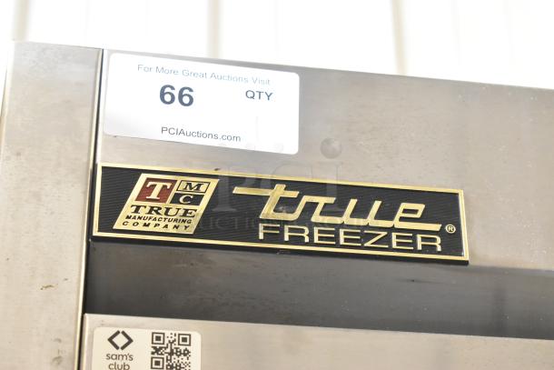 True T-19F stainless steel commercial single door freezer, on casters. Features brand plaque. Model and auction labels visible.