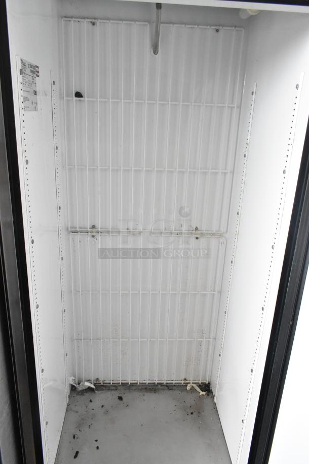 True T-19F stainless steel commercial freezer interior; single door, visible shelving, some dirt, label noted.