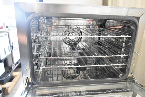 Cooking Performance Group COQ-T3-A stainless steel electric convection oven, 3 tray, 110V, broken glass visible.