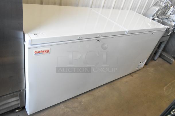 Brand new Galaxy 177CF25HC metal chest freezer with two hinge lids; 115 volts, 1 phase; visible scratch and dent.