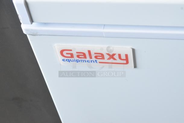 Brand new Galaxy 177CF25HC metal chest freezer, scratch and dent, with 2 hinge lids, 115V, 1 phase. Galaxy logo visible.