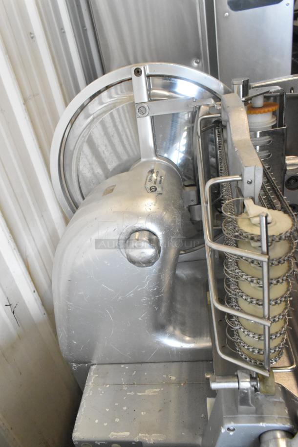 Bizerba 330 metal commercial floor-style meat slicer stacker. Shows visible wear. Model and voltage label present.