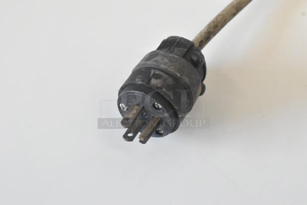 Black power plug for Bizerba 330 meat slicer, showing three prongs. Appears in used condition with some wear.