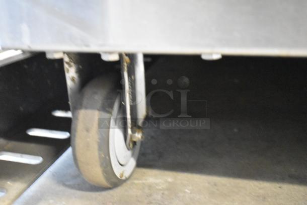 Fresh N Squeeze POS-1 citrus juicer wheel detail, stainless steel on commercial casters, 115V, 1-phase.