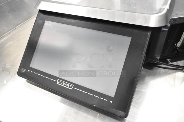 2023 Hobart HTi commercial countertop food portioning scale, touchscreen display, 120/208-240V, 1 Phase, excellent condition.