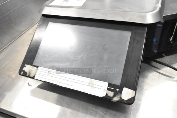 2016 Hobart HTi countertop food portioning scale, metal construction, visible screen, labels, used condition.