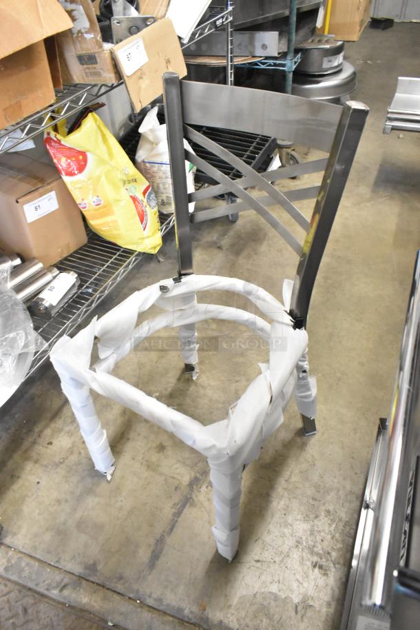 Gray metal dining chair frame with cross back, brand new with scratches and dents. Wrapped in protective material.