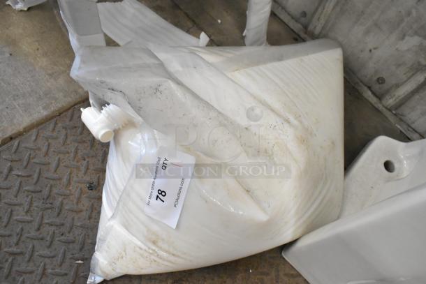 Bag of hand soap, slightly soiled, with a visible label reading "78 QTY 1" from PCAuctions.com.
