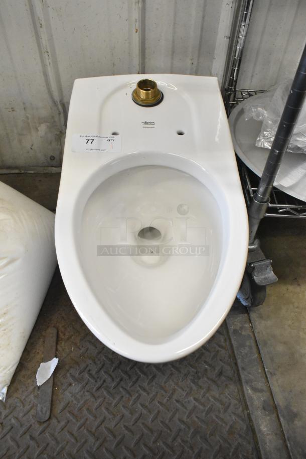 American Standard toilet bowl, white, missing tank. Label indicates auction item 77. Clean, no visible damage.
