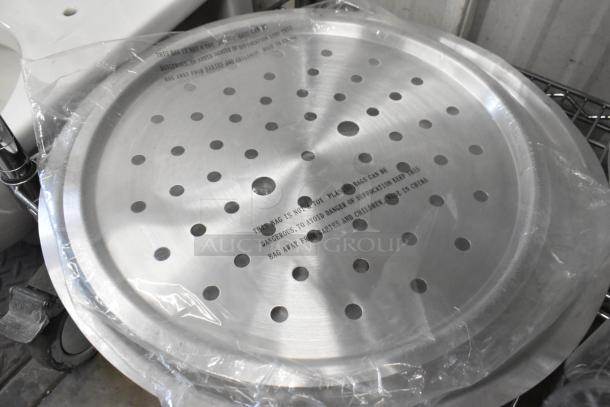 Nine new scratch and dent items, including a 471SPC20 Choice 12 5/8" aluminum pot/pan cover. Packaging shows warning text.