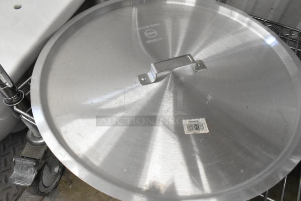 Aluminum pot/pan cover, 12 5/8", Model 471SPC20, new with minor scratches, made in China, includes label and handle.