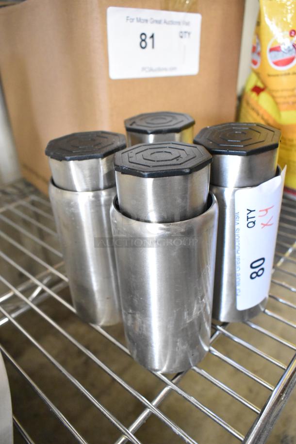 Lot of 4 five-inch metal legs with hexagonal black tops, in good condition, displayed on a metal shelf.