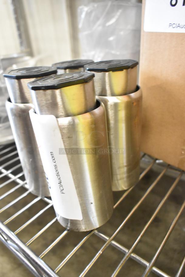 Lot of 4 metal legs, 5 inches tall, silver finish, with black caps. Includes a label from PCI Auctions.