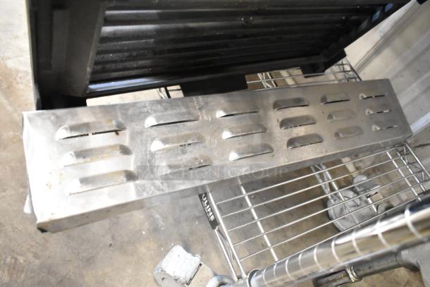 2 metal items: Turbochef stainless steel rapid cook oven kick plate, metal charbroiler grate; used condition.