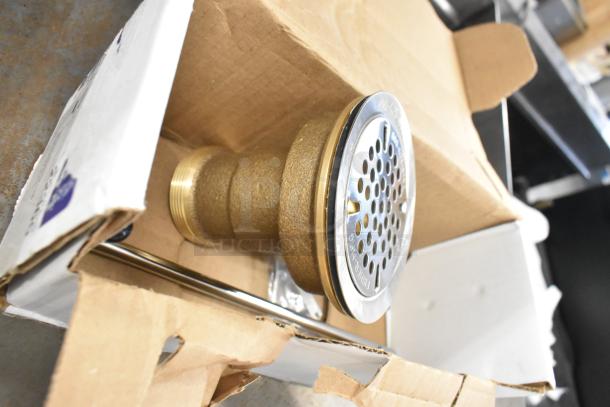 Brand new Fisher 22365 metal drain, brass finish, minor scratches and dents, in original packaging.