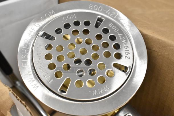 Brand new Fisher 22365 metal drain with visible scratch and dent. Features polished stainless steel, engraved branding.