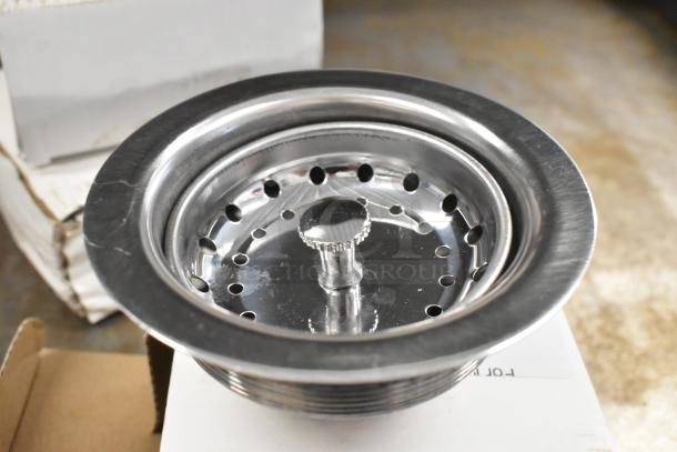 Brand new Regency 600DB35 metal drain, scratch and dent, stainless steel finish, with visible minor surface marks.