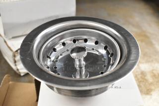 Brand new Regency 600DB35 metal drain, scratch and dent, stainless steel finish, with visible minor surface marks.