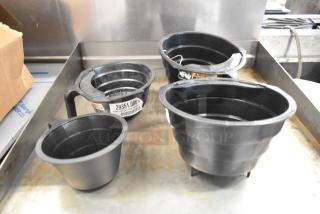 Four black poly brew baskets, varying sizes, lightly used. Visible labels show "29351.0007" and safety warnings.