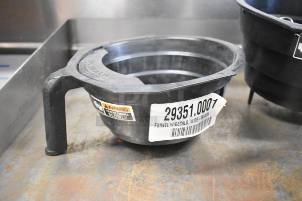 Set of 4 black poly brew baskets, wide with handle. Visible label indicates model 29351.0007. Good condition.