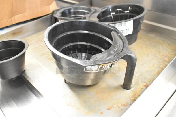 Four black poly brew baskets with "Hot Liquid" and "SplashGard" labels, in good condition.