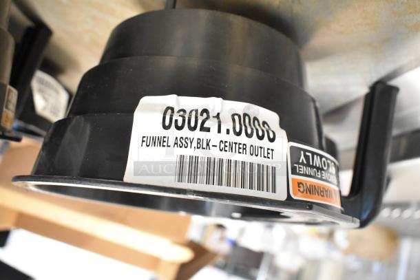 4 poly brew baskets, black, center outlet, labeled "Funnel Assy, BLK - Center Outlet" with code 03021.0008. Auction item.
