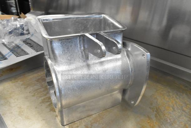 Metal grater attachment, silver finish, rectangular feed chute, sturdy construction, appears in good condition.