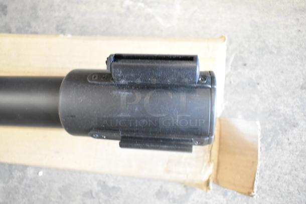 Brand new Update RS-36BK stanchion with minor scratches, shown atop cardboard packaging. Durable and ready for use.