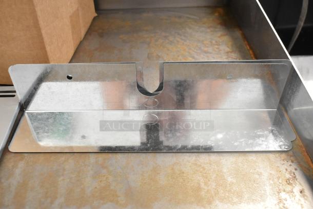 Box of assorted metal pieces, including flat metal sheet with cut-outs and holes, in used condition.