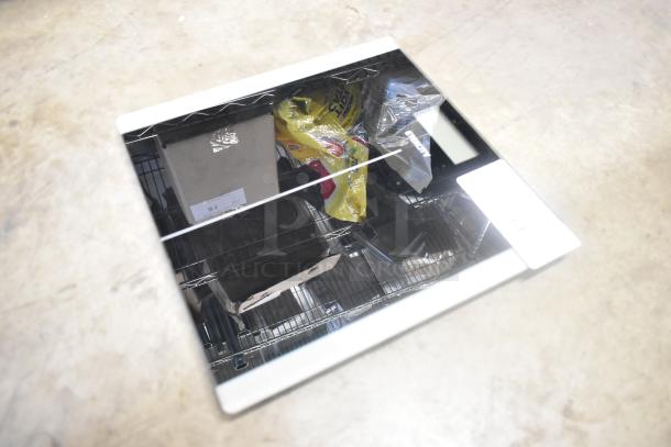 Etekcity EB9380H Scale, sleek glass surface. Reflective and clean condition. Ideal for precise weight measurement.