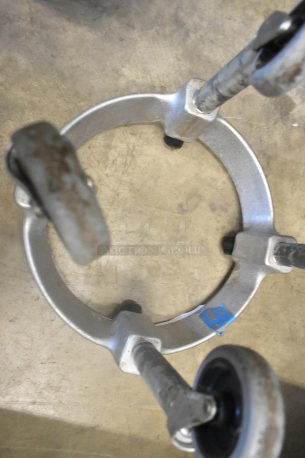 2 Mixing Bowl Dolly with commercial casters, metal frame, slight wear. Ideal for industrial kitchen use.