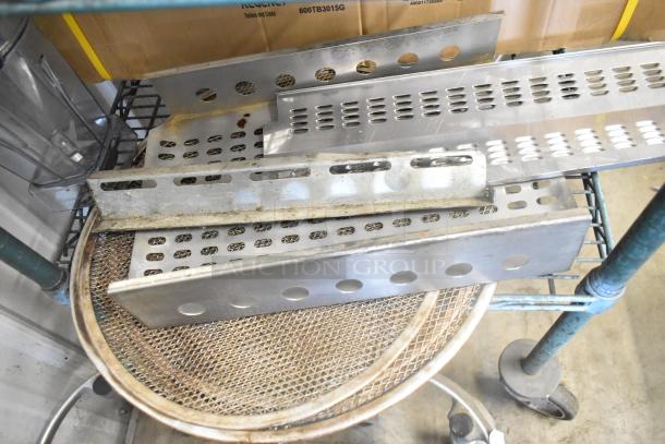 Lot of metal panels with perforated and solid sections, showing signs of wear. Ideal for industrial or DIY projects.