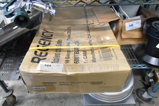 Boxed Regency 600TB3036G 30"x36" stainless steel work table with 4" backsplash, galvanized undershelf. Contains visible dents.
