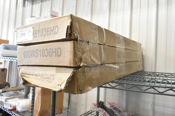 Three new Regency 600WS1036HD 10"x36" stainless steel wall shelves in boxes marked with model number; slight box wear.