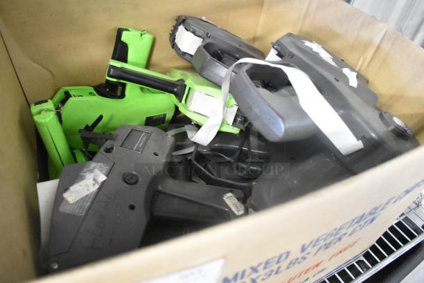 Box of 15 price guns, including Monarch 1177, mixed colors and models, used condition with visible labels and markings.